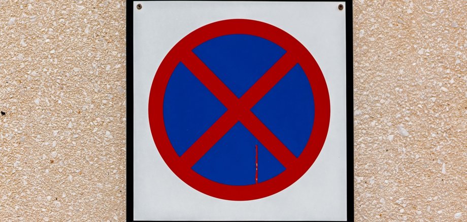 Stop and parking are prohibited sign on sand wall
